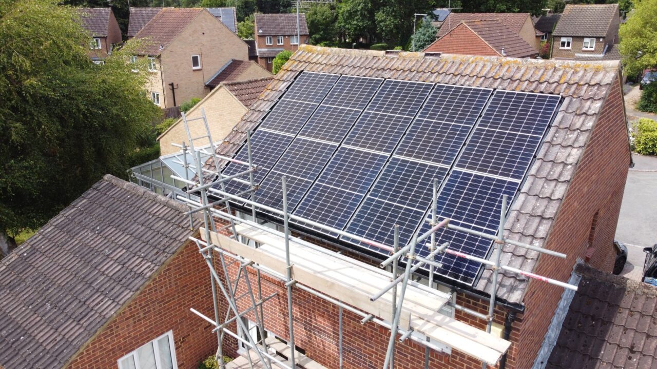 solar panels on a roof with scaffolding